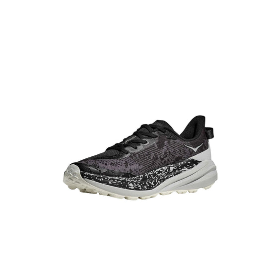 Black trail running shoe with white speckled midsole, lugged outsole, and low-cut profile