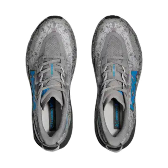 Gray trail running shoes with blue side accents, shown from above