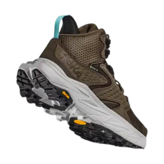 Brown mid-top hiking boot with black lugged sole, mesh upper, and turquoise heel pull tab