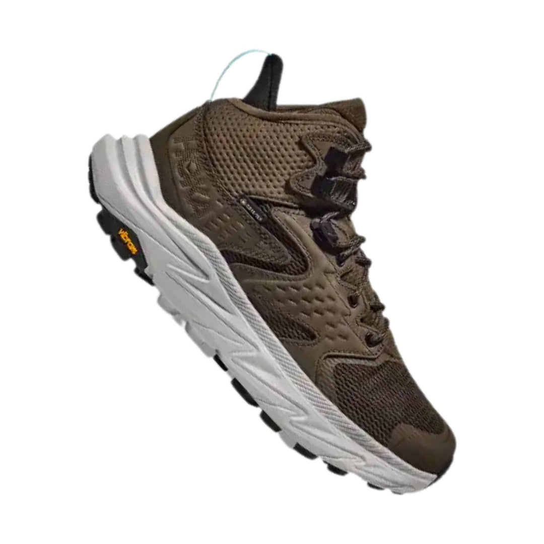 Brown mid-cut hiking shoe with mesh upper, white chunky sole, and black outsole lugs