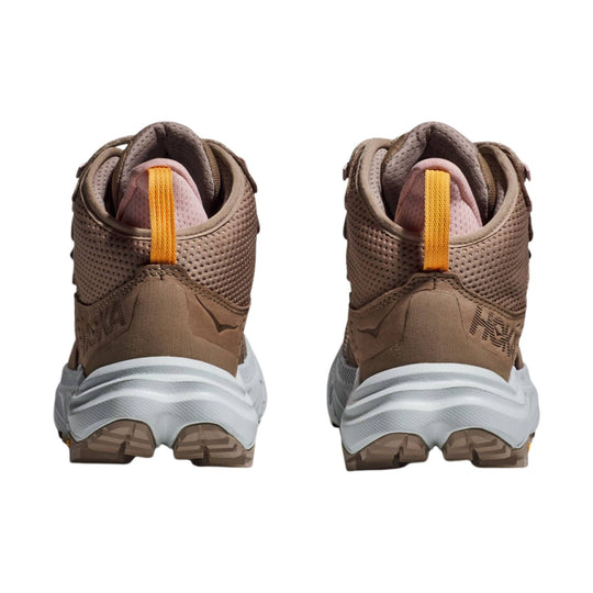 Brown mid-top hiking boots with orange pull tabs, pink collars, and white midsoles shown from the back