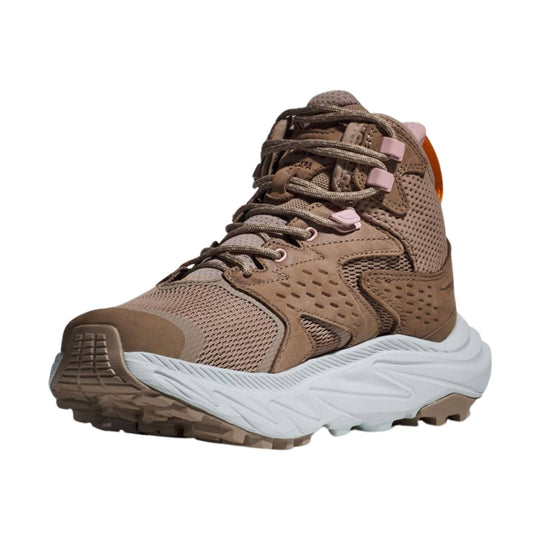 Brown mid-top hiking shoe with mesh and suede overlays, pink lace hardware, and a white cushioned sole