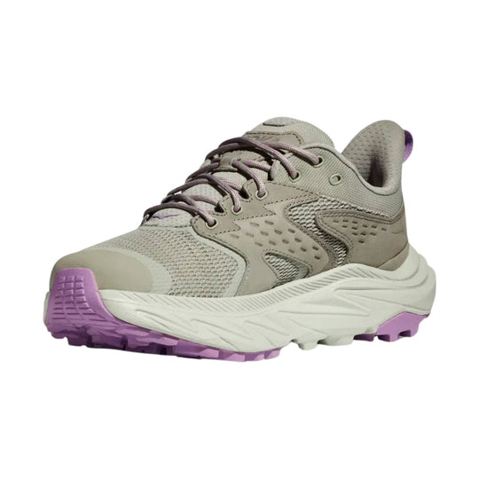 Light gray low hiking shoe with purple outsole and accents, shown in side view