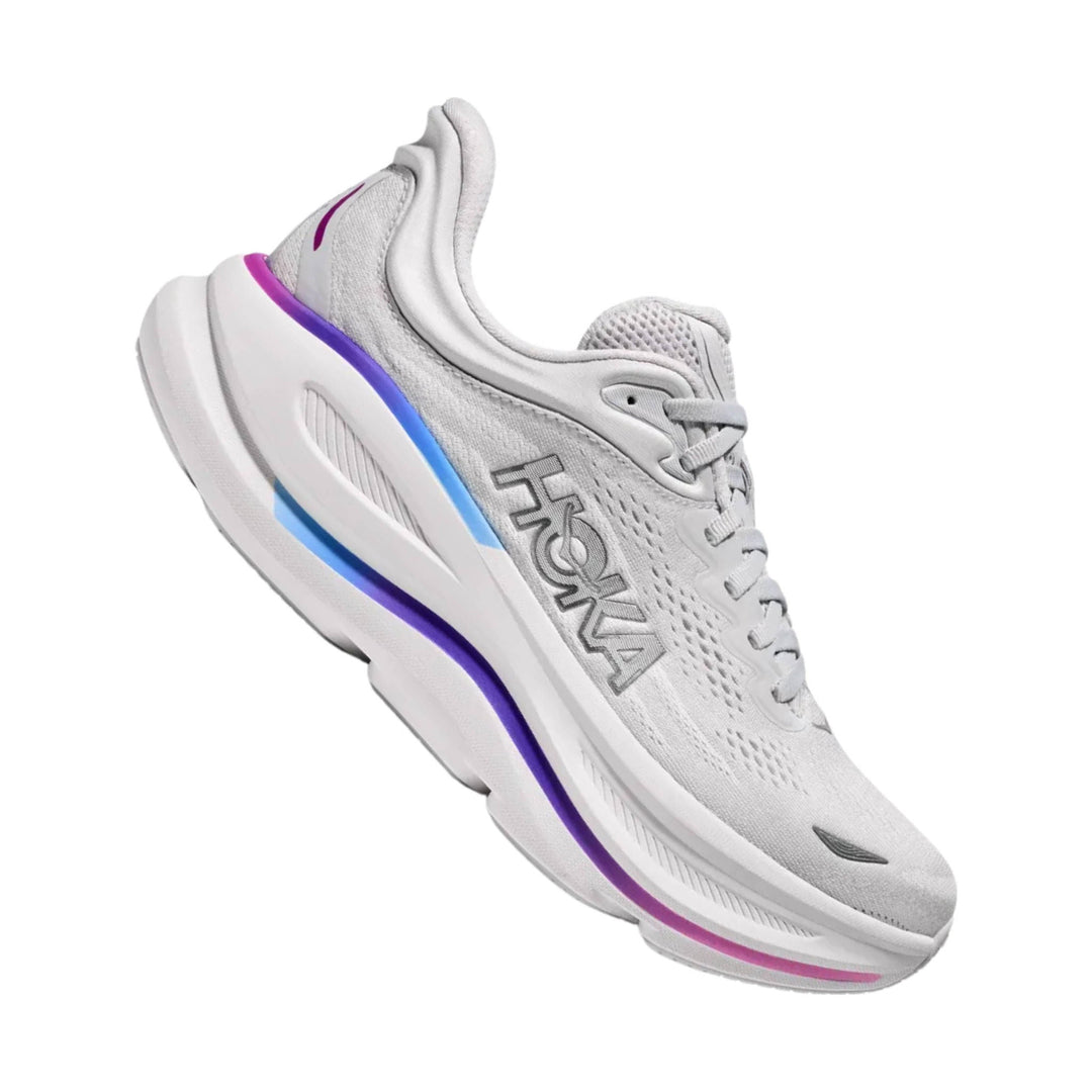 White running shoe with purple and blue midsole accents and HOKA logo on the side