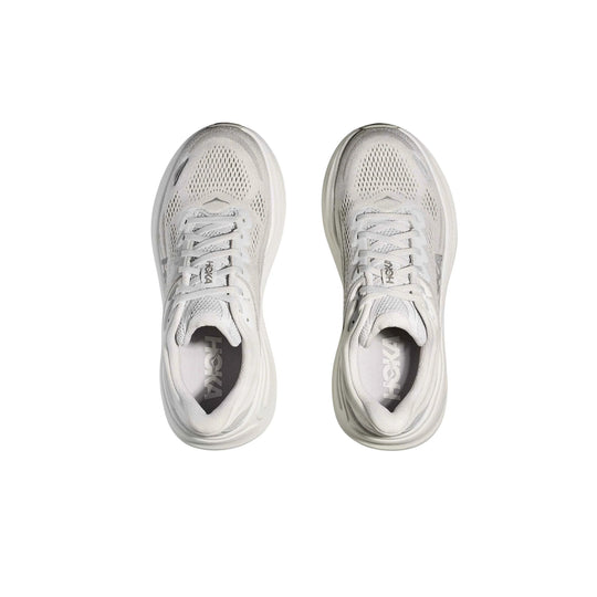 Pair of white running shoes with mesh uppers and thick cushioned soles, shown from above