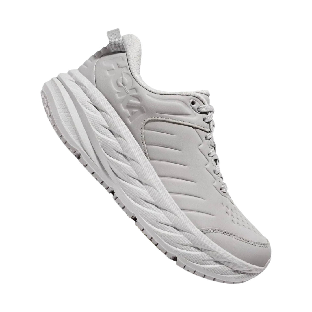 Light gray slip-resistant athletic shoe with embossed side logo and thick cushioned sole