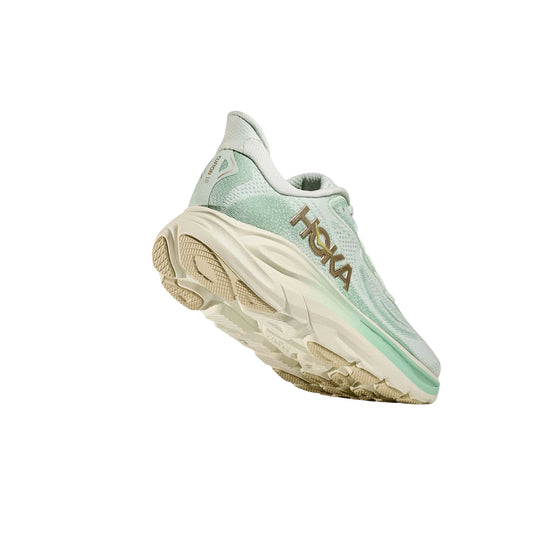 Mint green and cream running shoe shown from the side and sole, with HOKA branding