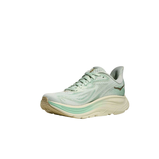 Light mint and cream running shoe with chunky cushioned sole and lace-up front
