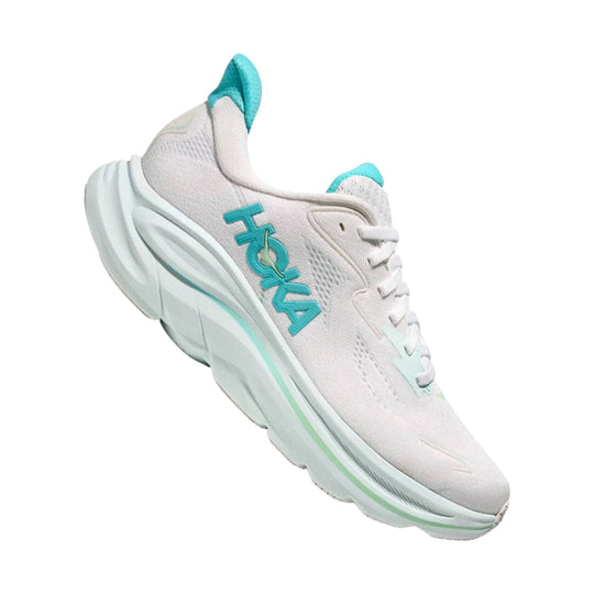 White running shoe with teal accents and a large HOKA logo on the side