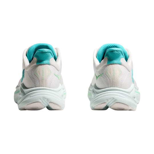 Rear view of white running shoes with teal collars and light mint accents
