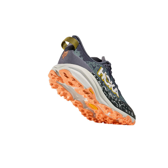 Gray and black trail running shoe shown from the side and sole, with orange lugged outsole and HOKA logo