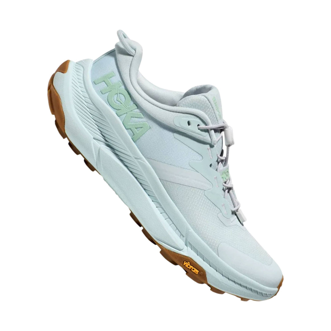 Light gray trail shoe with mint side logo, white laces, and gum outsole