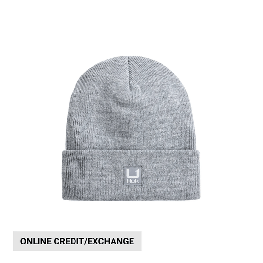 Light gray knit beanie with folded cuff and Huk patch; banner reads online credit/exchange