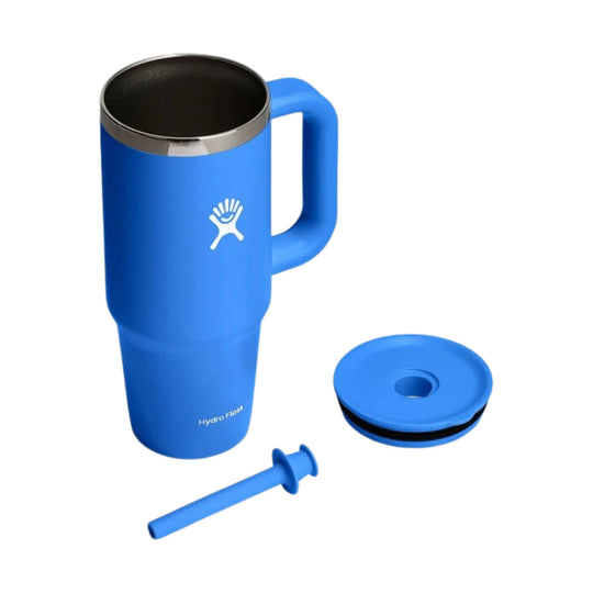 Blue stainless steel travel tumbler with handle, lid, and straw