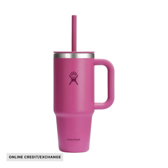 Pink handled travel tumbler with lid and straw, featuring a small logo and ONLINE CREDIT/EXCHANGE label