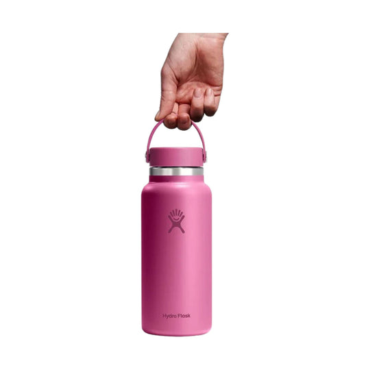 Pink insulated water bottle with a loop handle and visible Hydro Flask logo.