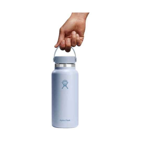Light blue stainless steel water bottle with carry loop and Hydro Flask logo