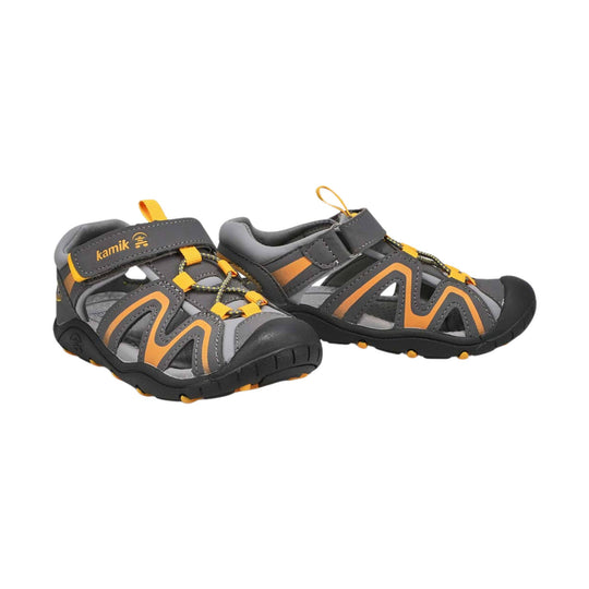 Pair of gray and orange closed-toe kids' sandals with hook-and-loop straps and black rubber soles