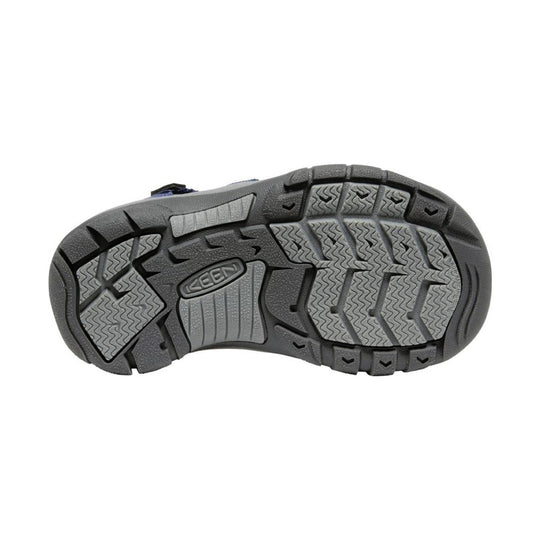 Gray and black shoe sole with wavy tread and KEEN logo