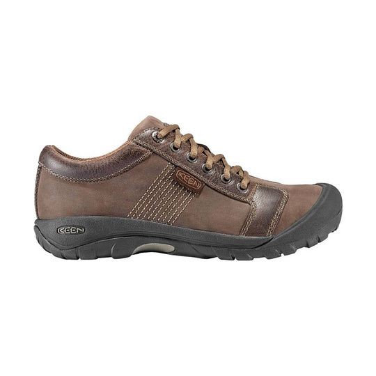 Brown leather lace-up hiking shoe with black rubber toe cap and rugged outsole
