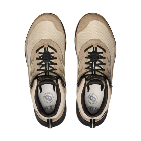 Tan and beige hiking boots with black laces, shown top-down.