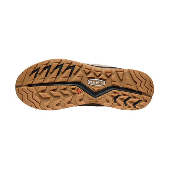 Tan hiking boot sole with deep lug tread and KEEN logo