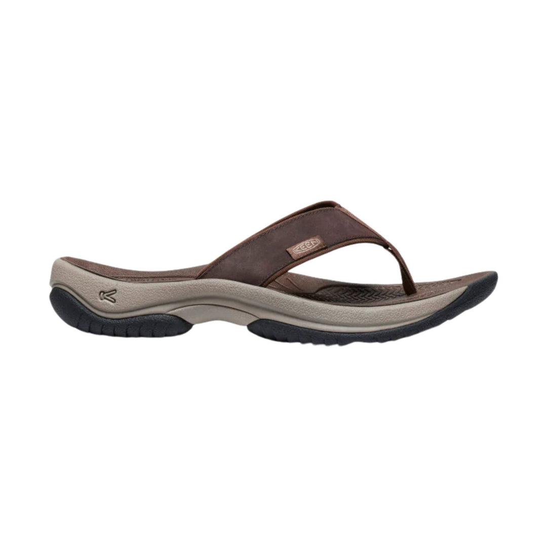 Brown and tan thong sandal with a curved sole and rugged black tread