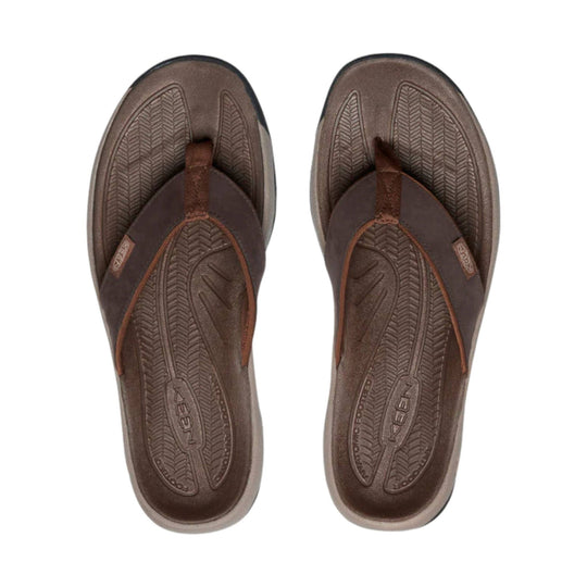 Brown leather thong sandals with textured footbeds and KEEN logos on the insoles
