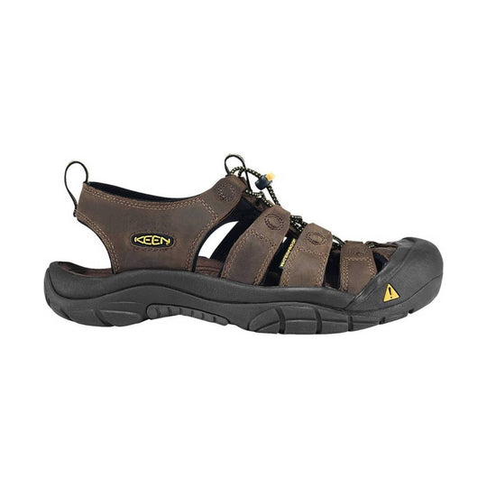 Brown sandal with black sole on a white background