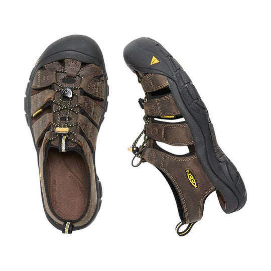 Pair of brown hiking sandals with visible brand logo on a white background