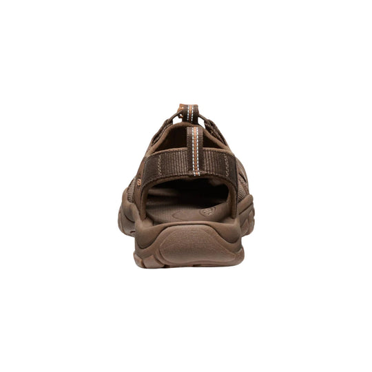 Brown closed-toe hiking sandal shown from the back with a thick treaded sole and fabric heel strap