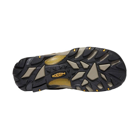 Hiking shoe outsole with black tread, gray lugs, and KEEN logo on a white background