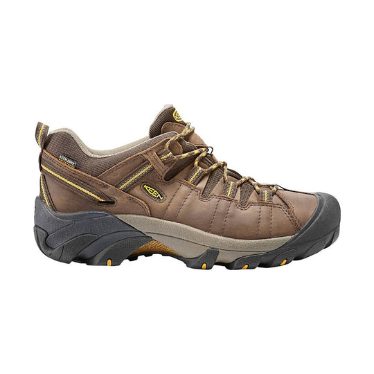 Brown low-cut hiking shoe with yellow accents, bungee laces, and a black rubber toe cap