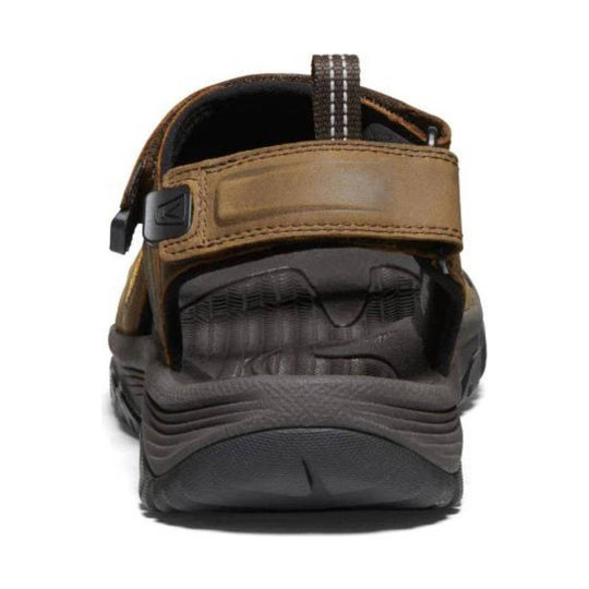 Brown and dark gray open-toe hiking sandal with a wide strap, bungee pull tab, and rugged tread