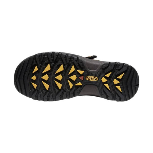 Black hiking sandal outsole with yellow tread inserts and KEEN logo