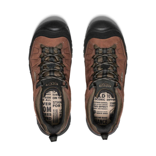 Brown and black hiking shoes viewed from above, with bungee laces and printed insoles