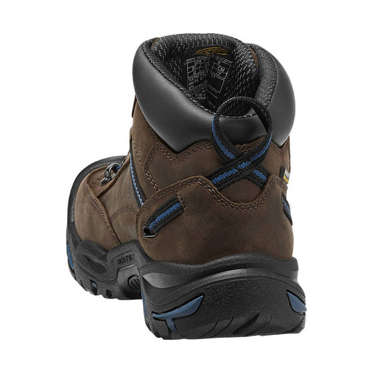 Brown hiking boots with blue accents on a white background