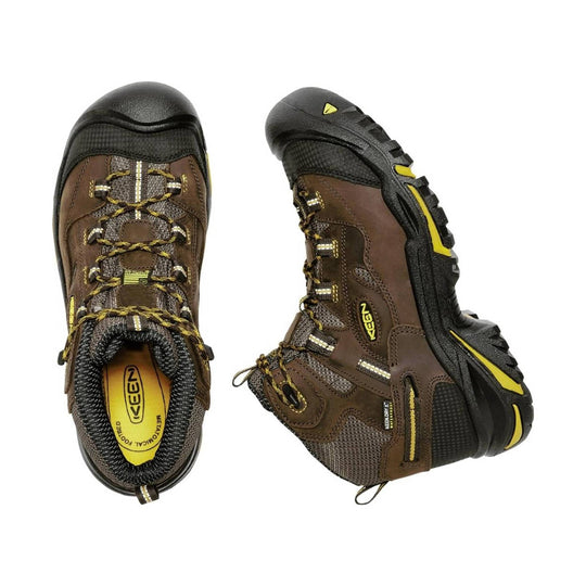 Pair of brown and black Keen hiking boots with yellow accents on a white background