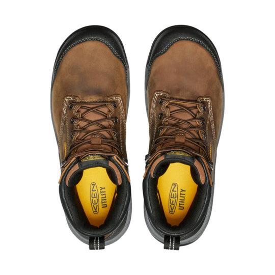 Brown and black leather work boots with yellow insoles, shown from above