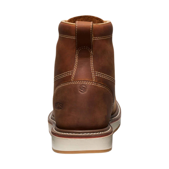 Brown leather work boot shown from the back with contrast stitching and a light-colored outsole