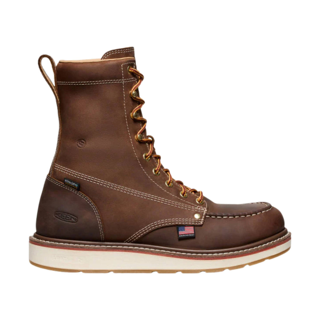 Brown lace-up work boot with a rubber toe, white midsole, and pull loop at the heel