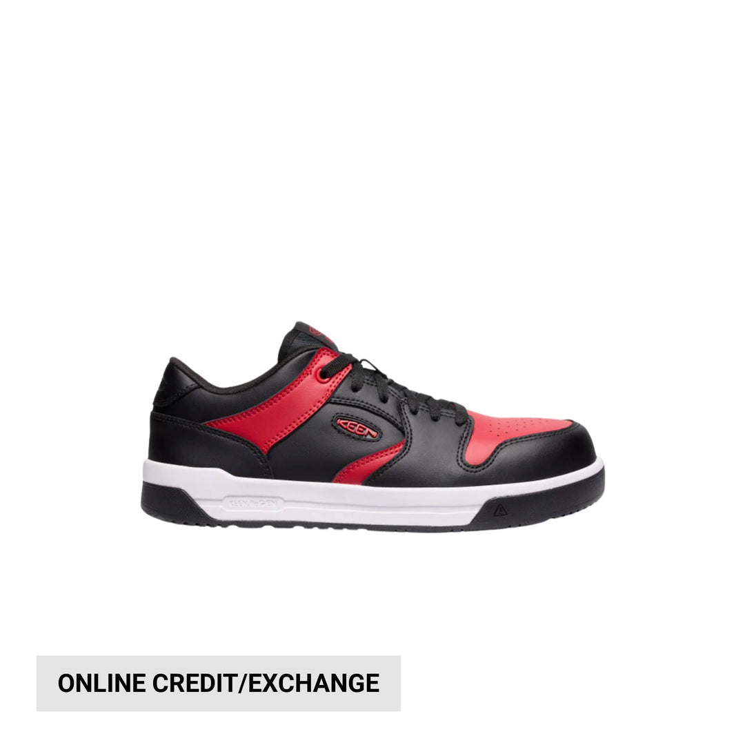 Black and red low-top work shoe with a white midsole and black outsole