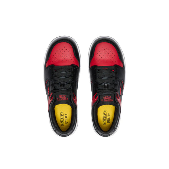 Black and red low-top work shoes with perforated red toe boxes and yellow insoles