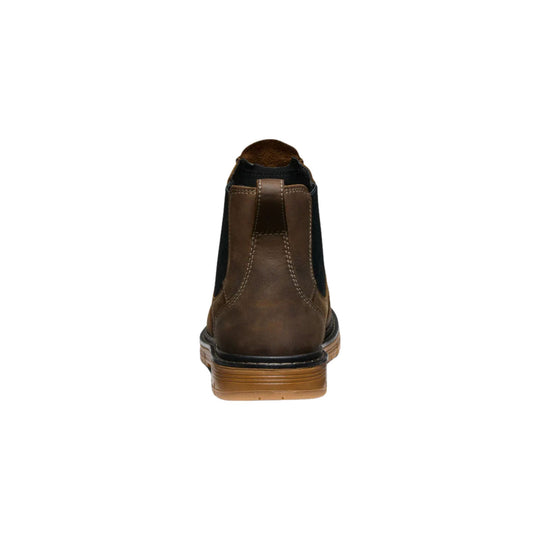 Brown leather Chelsea work boot shown from the back with a gum sole.