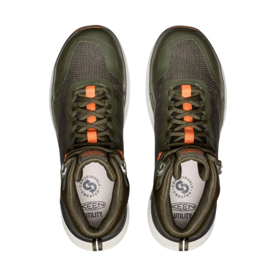 Top view of a pair of olive and black work boots with orange lace accents