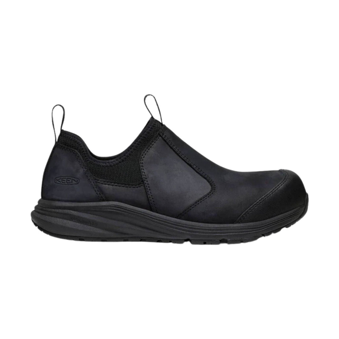 Black slip-on work shoe with elastic heel loops and a thick treaded sole