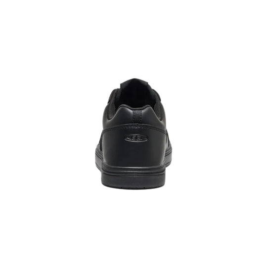 Black low-top work shoe shown from the back