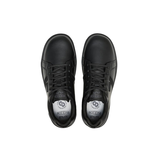 Black low-top work shoes with laces and rounded toes, shown from above