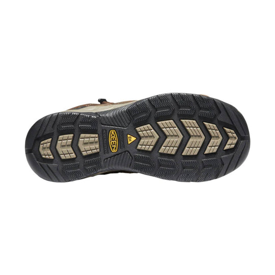 Black boot outsole with tan traction inserts and KEEN logo