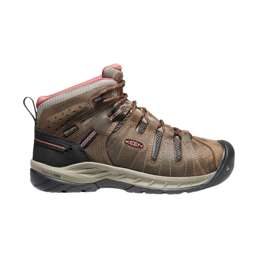 Brown mid-height hiking boot with pink trim, black toe cap, and laces